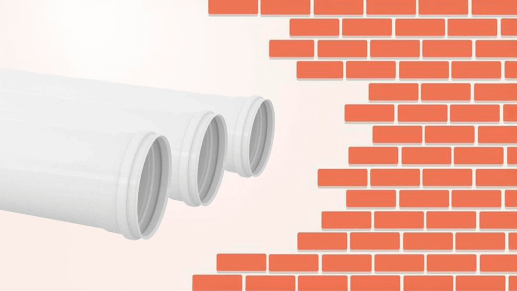 Tubos de esgoto fabricados pela H3 Plastic, em destaque com fundo de tijolos, representando versatilidade e resistência para projetos residenciais, comerciais e industriais.